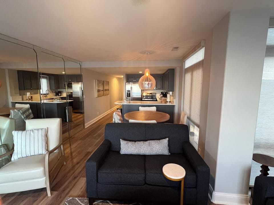 From beach side looking into the unit.  Sofa is also to the left with bay window