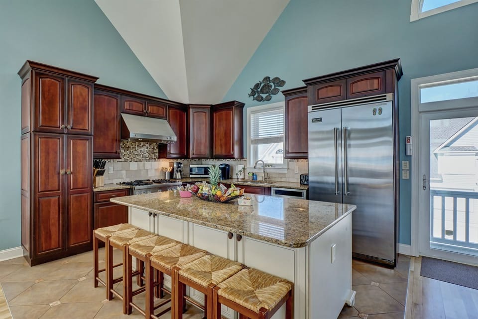 Well stocked kitchen with stainless appliances
