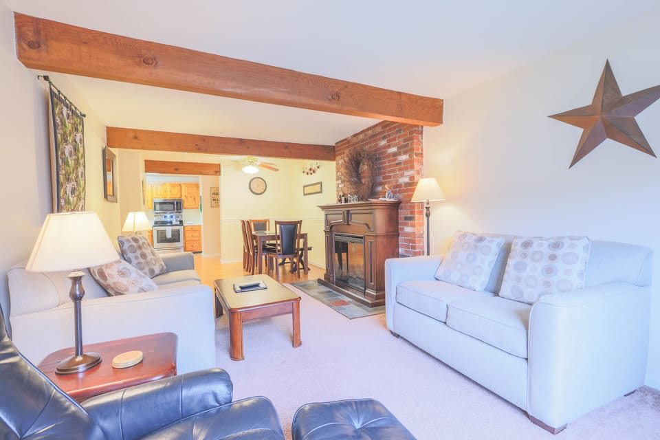 Cozy living area comfortable seating and an electric fireplace