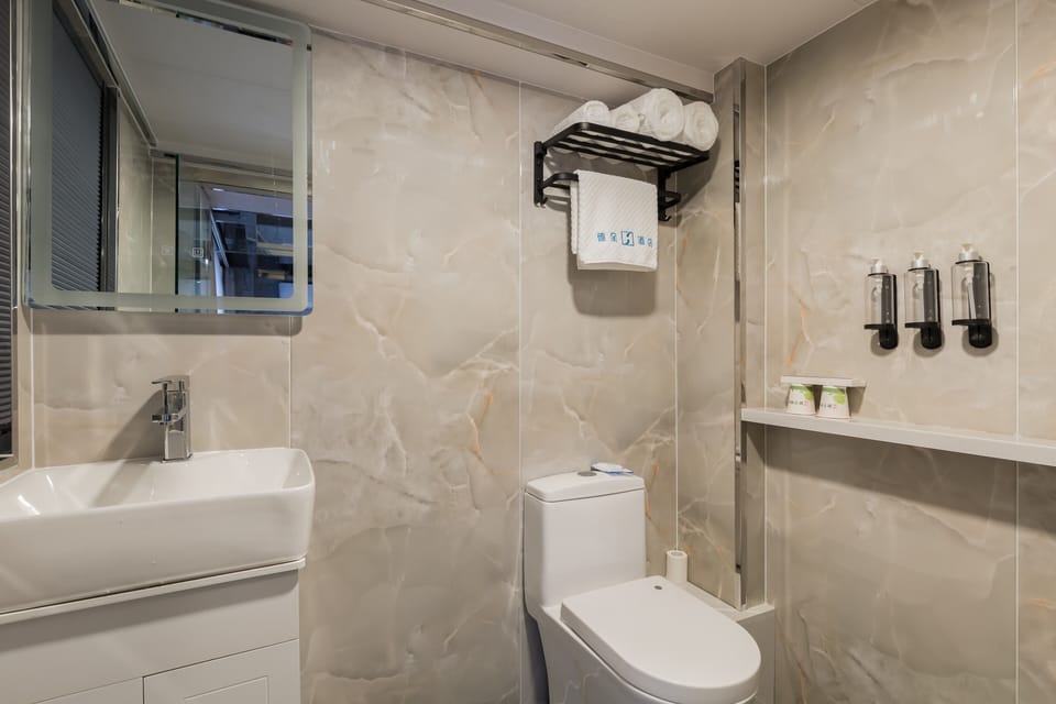 Shower, free toiletries, hair dryer, slippers