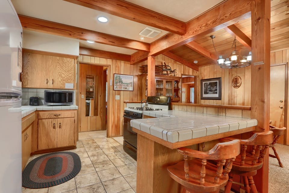 Kitchen with a bar with seating for two