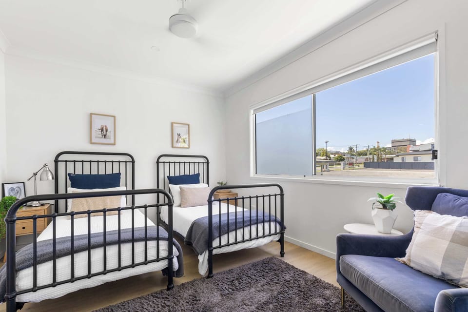 Two single beds 🛏️🛏️ with ceiling fan 🌬️ and wardrobe 👕. Comfortable and perfect for kids or extra guests.