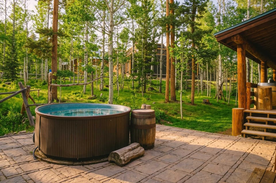 Hot Tub: 6-person capacity, surrounded by forest