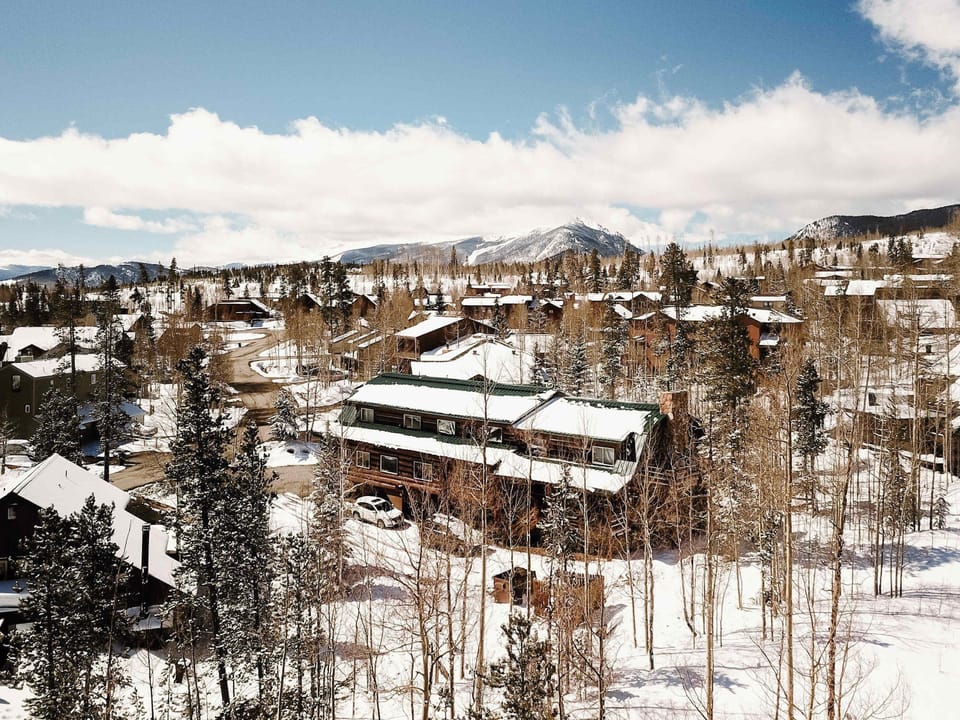 Exterior shot of cabin during winter.