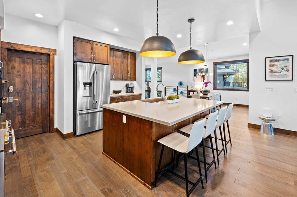 Kitchen: Drip coffee maker, Crockpot, blender, cooking utensils, tableware, toaster oven, main floor