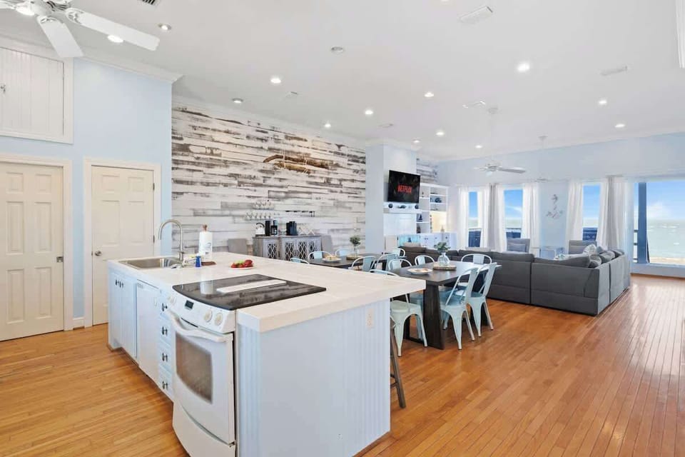 Dine with a view!  This elegant dining area, complete with a spacious table and natural light streaming through large windows, sets the perfect mood for family feasts and cozy gatherings #GatherAndDine 