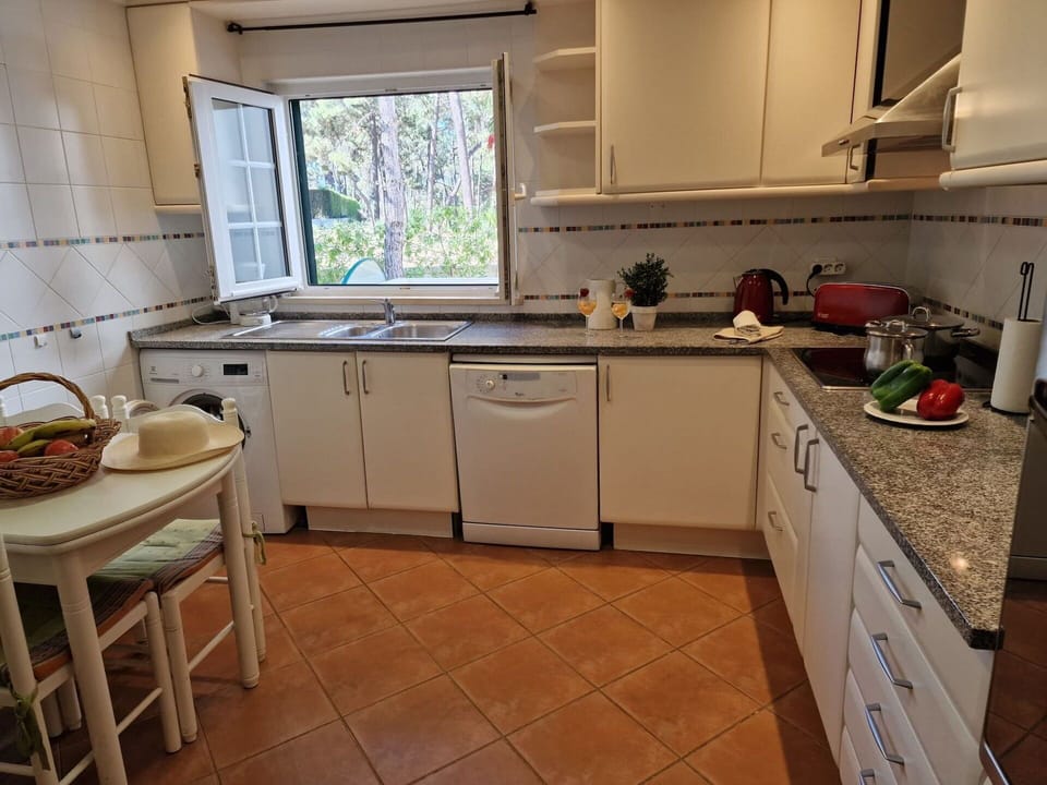 Kitchen Appliance, Kitchen, Countertop, Furniture, Major Appliance, Cabinetry, Flooring, Kitchen Sink, Wood, Kitchen Stove