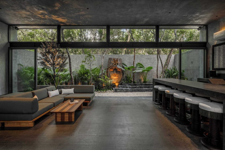Open-air living flows seamlessly from the lounge to the jungle beyond.