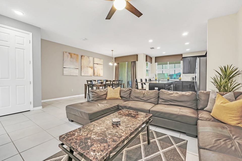 Open-concept living and dining area with modern furnishings and natural light.