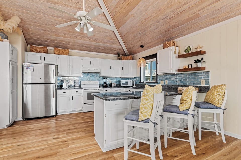 Kitchen with Bar Stool Seating on Third Level