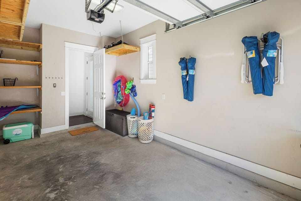 Garage with 4+ chairs, umbrella, toys, puddle jumpers, floats and rolling cooler