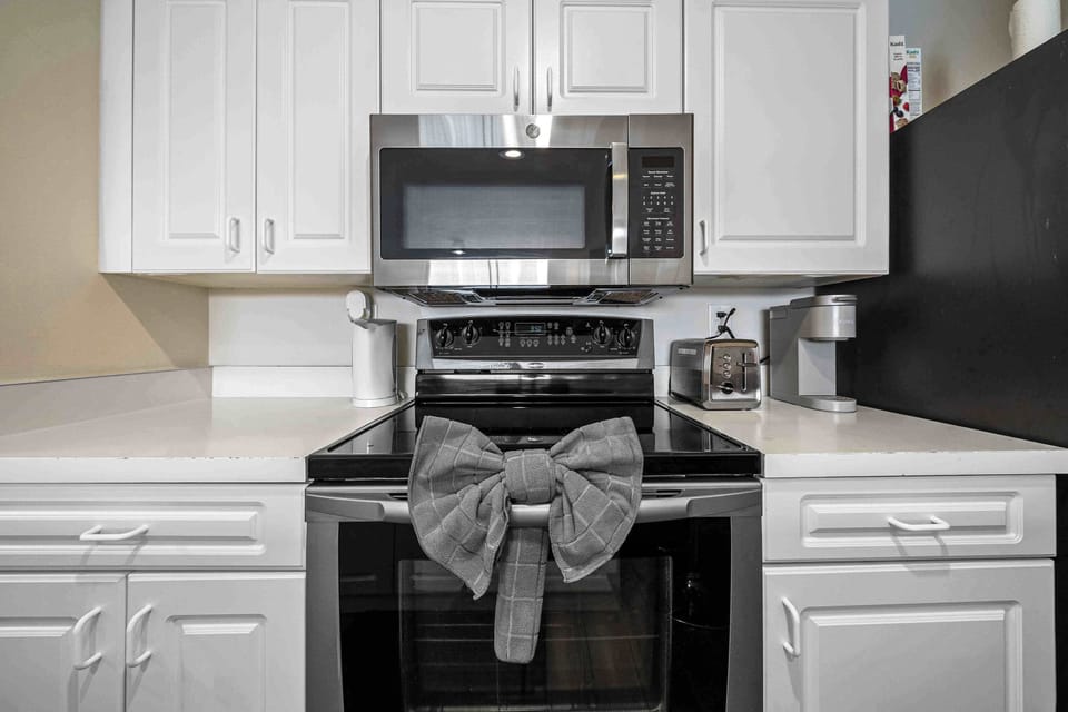 Condo, 1 Queen Bed, Balcony (The Urban Oasis) | Private kitchen | Fridge, microwave, oven, stovetop
