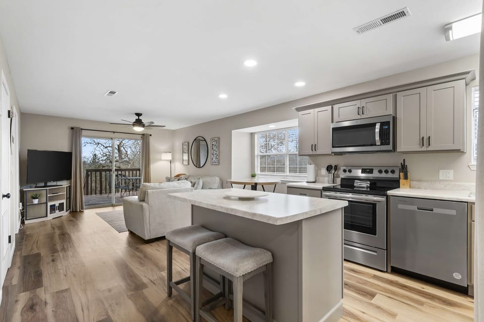The bright, open kitchen offers ample space & every home comfort