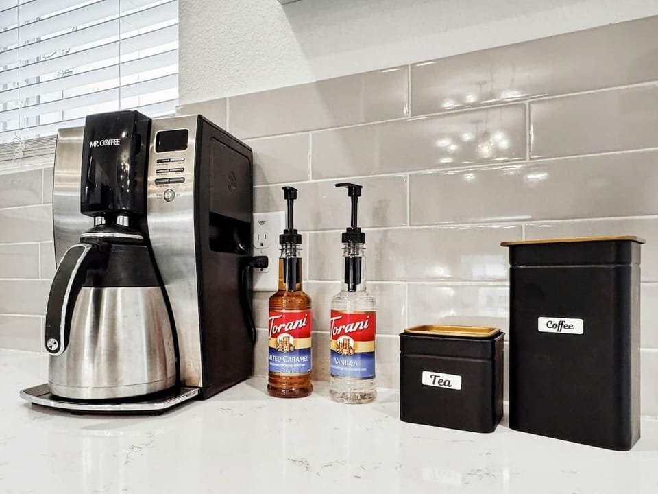Coffee, tea, sugar, milk & syrups. 
