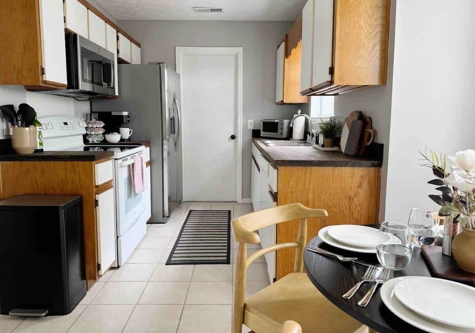 This cozy kitchen is compact, yet efficient, though counter space is limited, there is still enough room to prepare any meal!