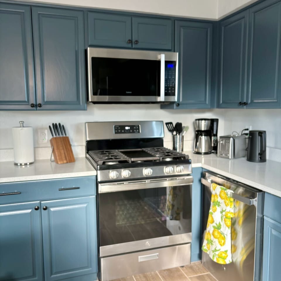 Fully equipped kitchen with gas stove.