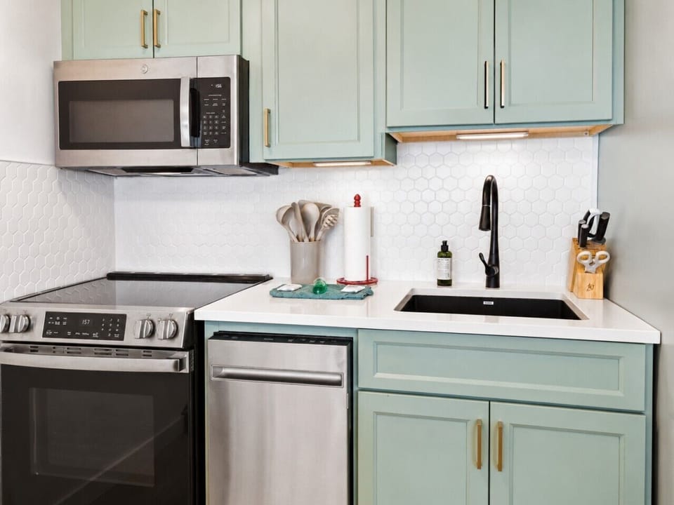 New kitchen with stainless steel appliances