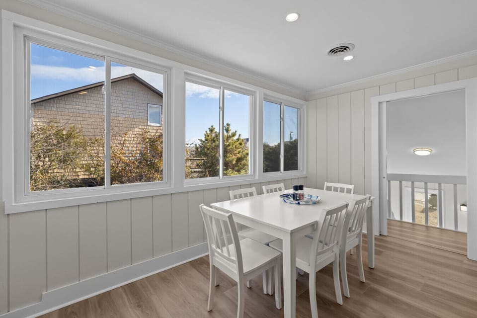 This nice dining space with large windows that fill every moment with family is to be treasured.