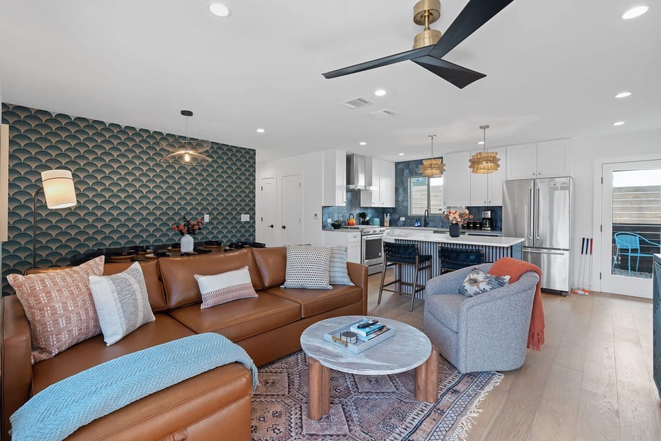 Living Room: Chic design unites comfort & style, with vibrant decor and an open flow to the kitchen! + Queen Sleeper Sofa