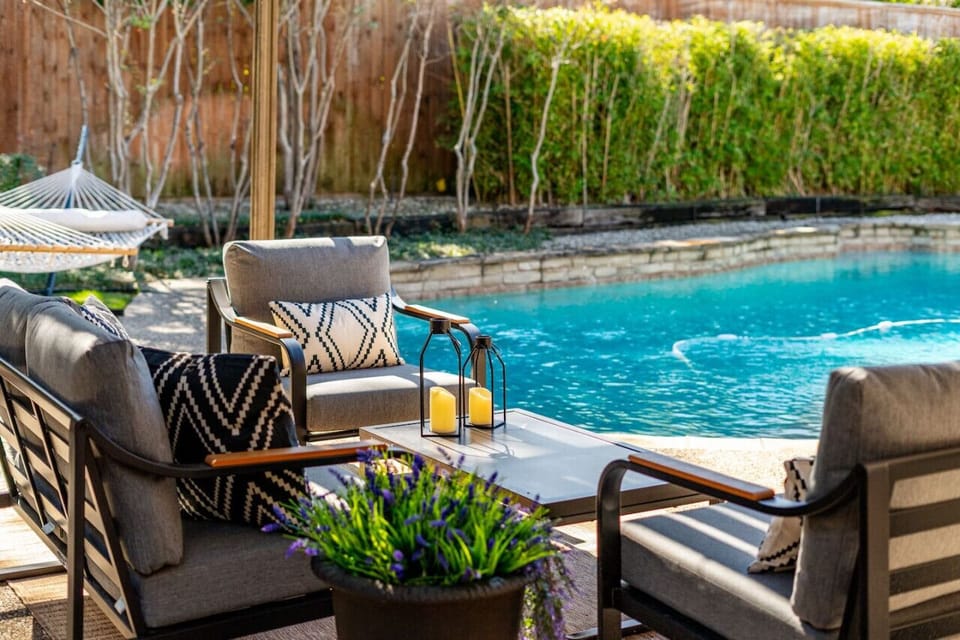 Cozy  A cozy patio with a relaxing view of the pool and a hammock