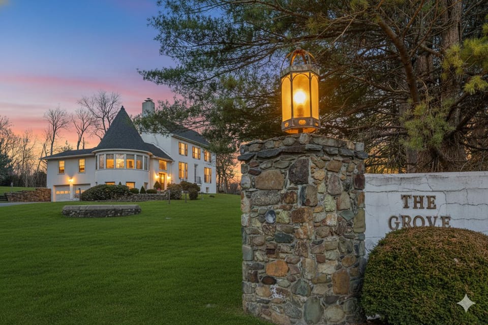 Welcome to The Grove! Enchanting stone entrance welcomes you to an unforgettable getaway under vibrant skies!