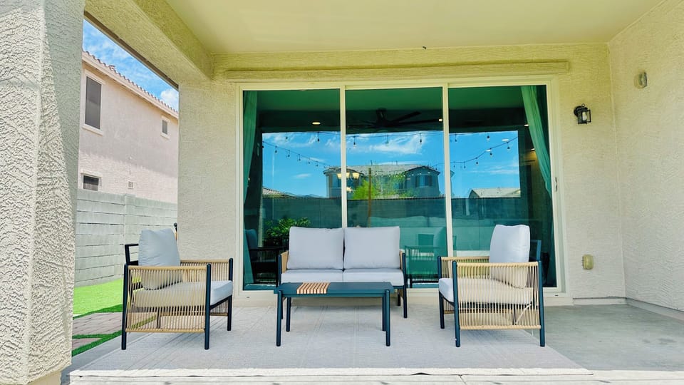 Backyard covered patio with sun shade. 