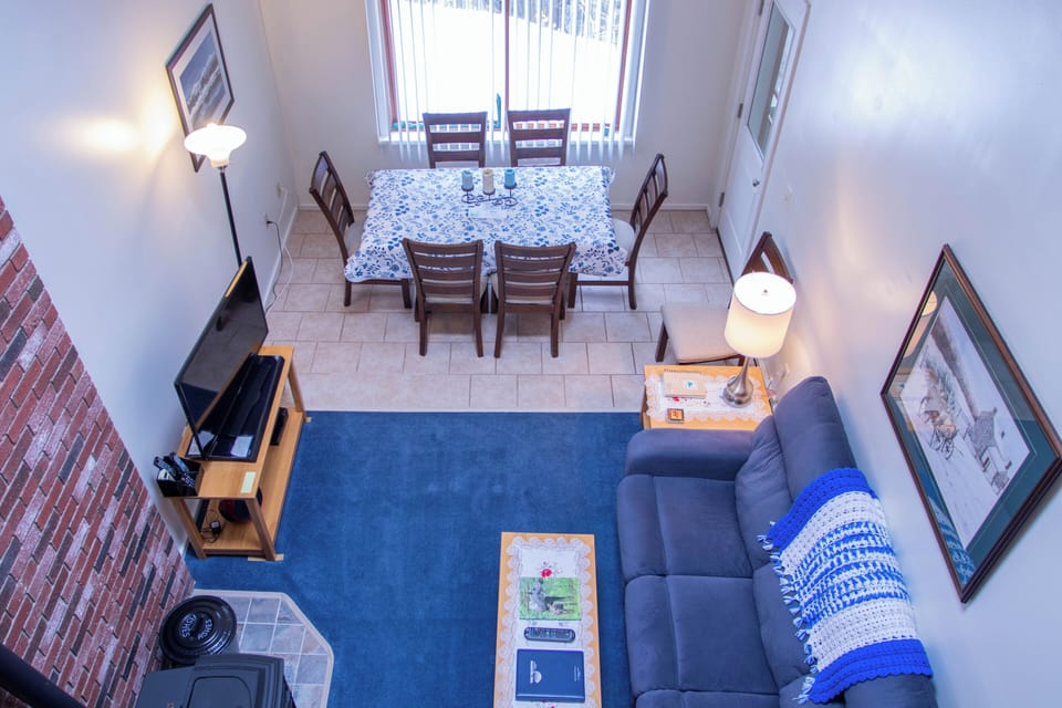View from loft down to living room & dining area