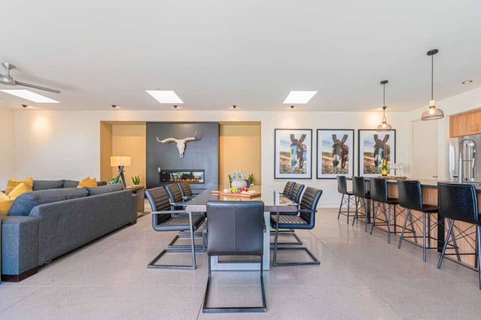 Open living & dining w/ sectional, table for six & island bar stools for big groups.