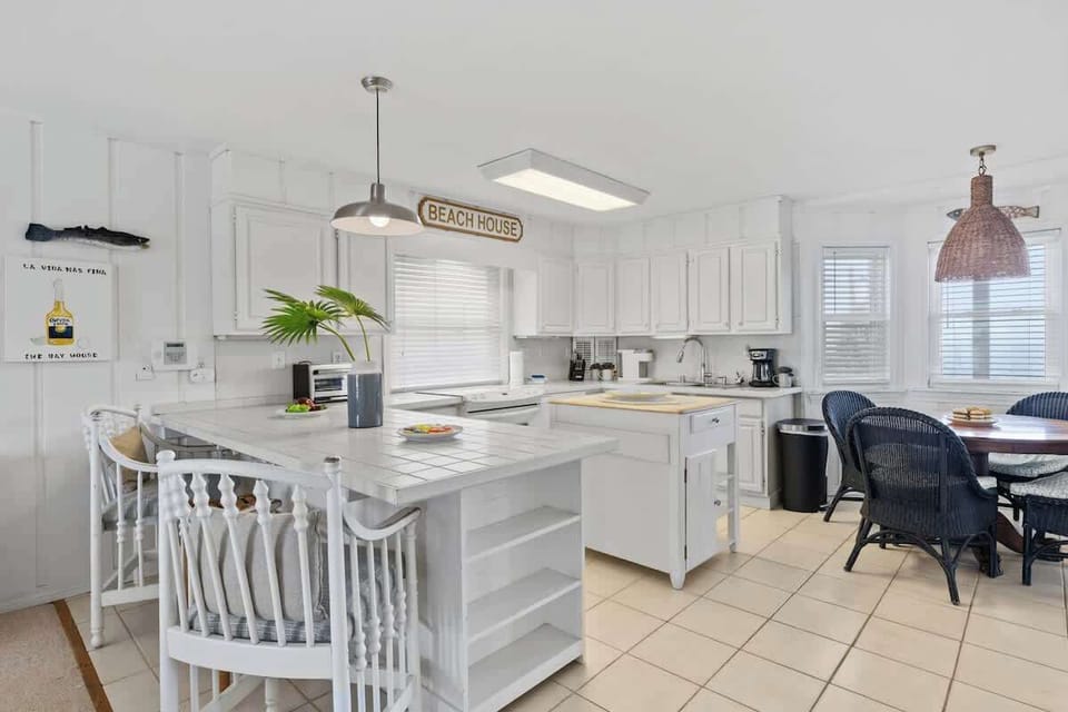 Morning coffee with a side of coastal charm! Whether you're starting the day with a fresh brew or gathering for a sunset dinner, this kitchen's open, inviting design makes every moment feel like a vacation #RelaxAndDine 