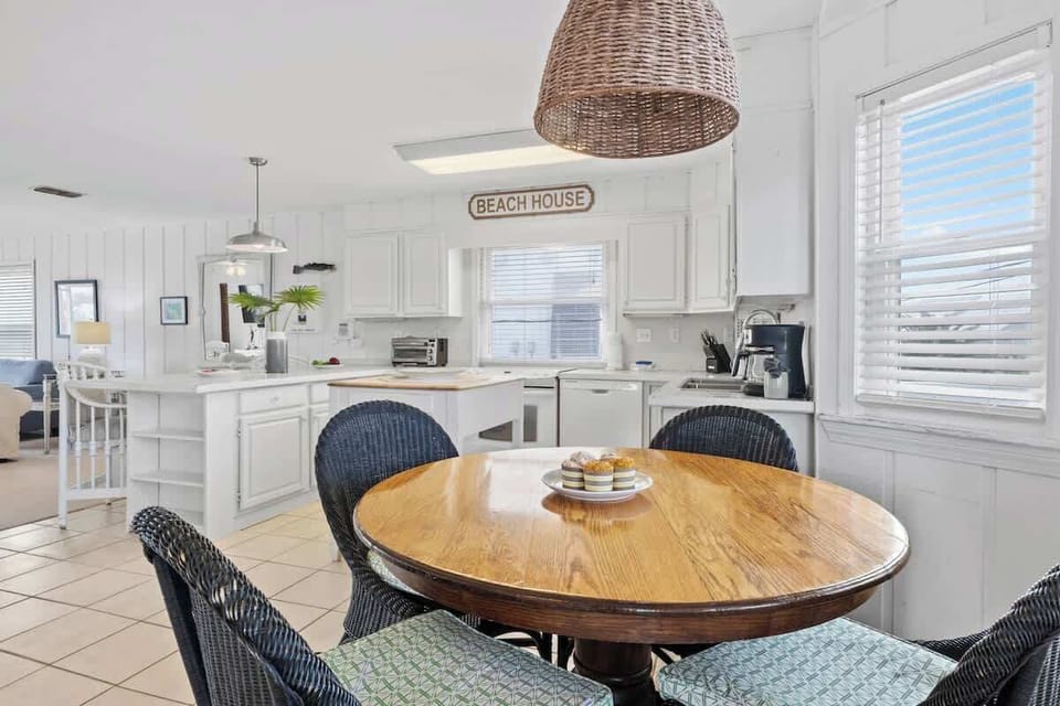 Dine with a touch of coastal charm! Surrounded by natural light and breezy beach vibes, this inviting dining area is perfect for savoring meals and making memories #SeasideDining