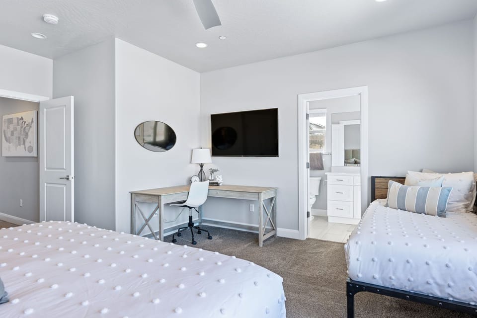 Spacious upper-level master with with a private desk for work or relaxation