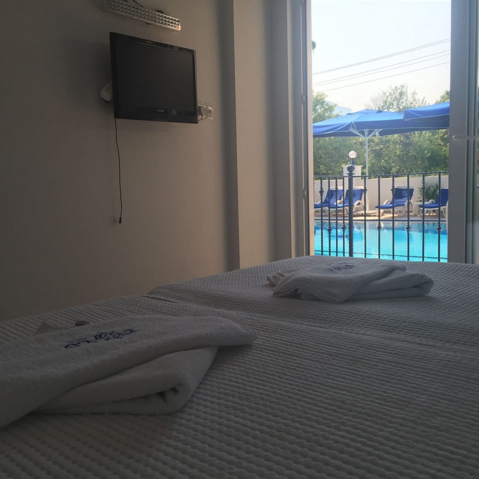 Family Room, 2 Bedrooms, Connecting Rooms | Minibar, in-room safe, free WiFi, bed sheets