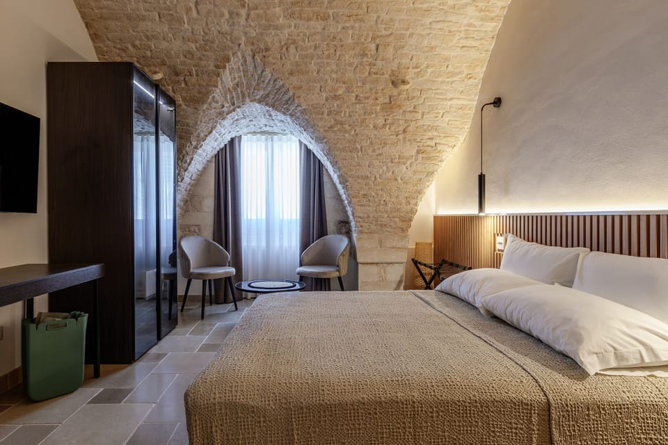 Superior Suite, City View | Minibar, in-room safe, desk, blackout drapes