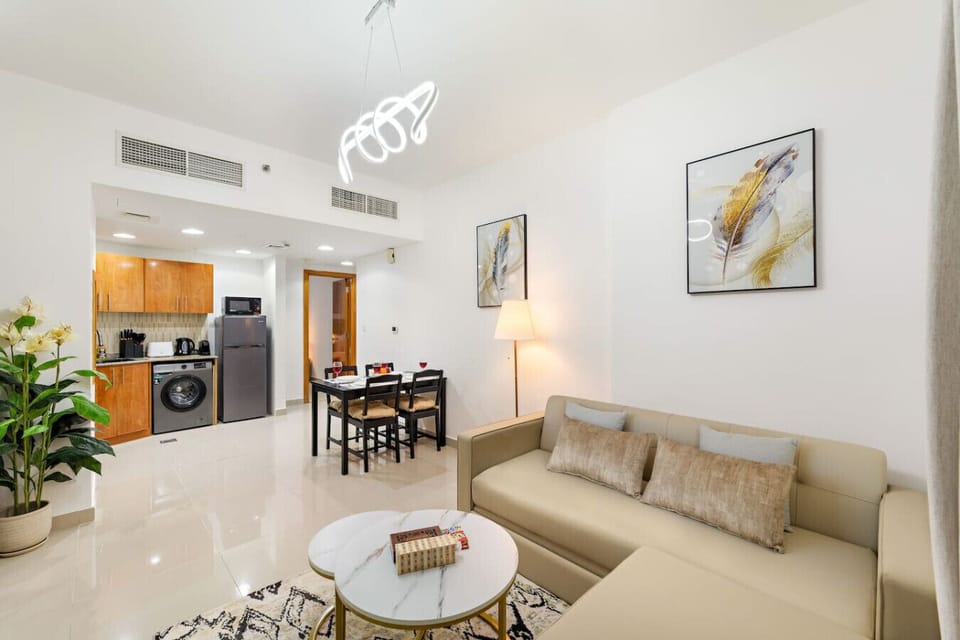 Living Room: Stylish space with modern furniture, perfect for relaxing after a Dubai adventure!