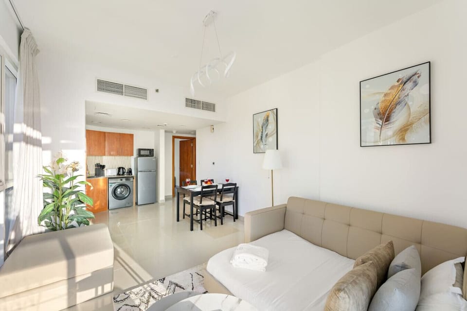 Living Room: Modern elegance with vibrant decor, enjoy natural light and a stylish dining area!