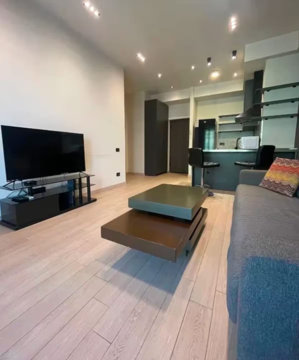 Signature Condo, Non Smoking, Balcony | Living room | Flat-screen TV