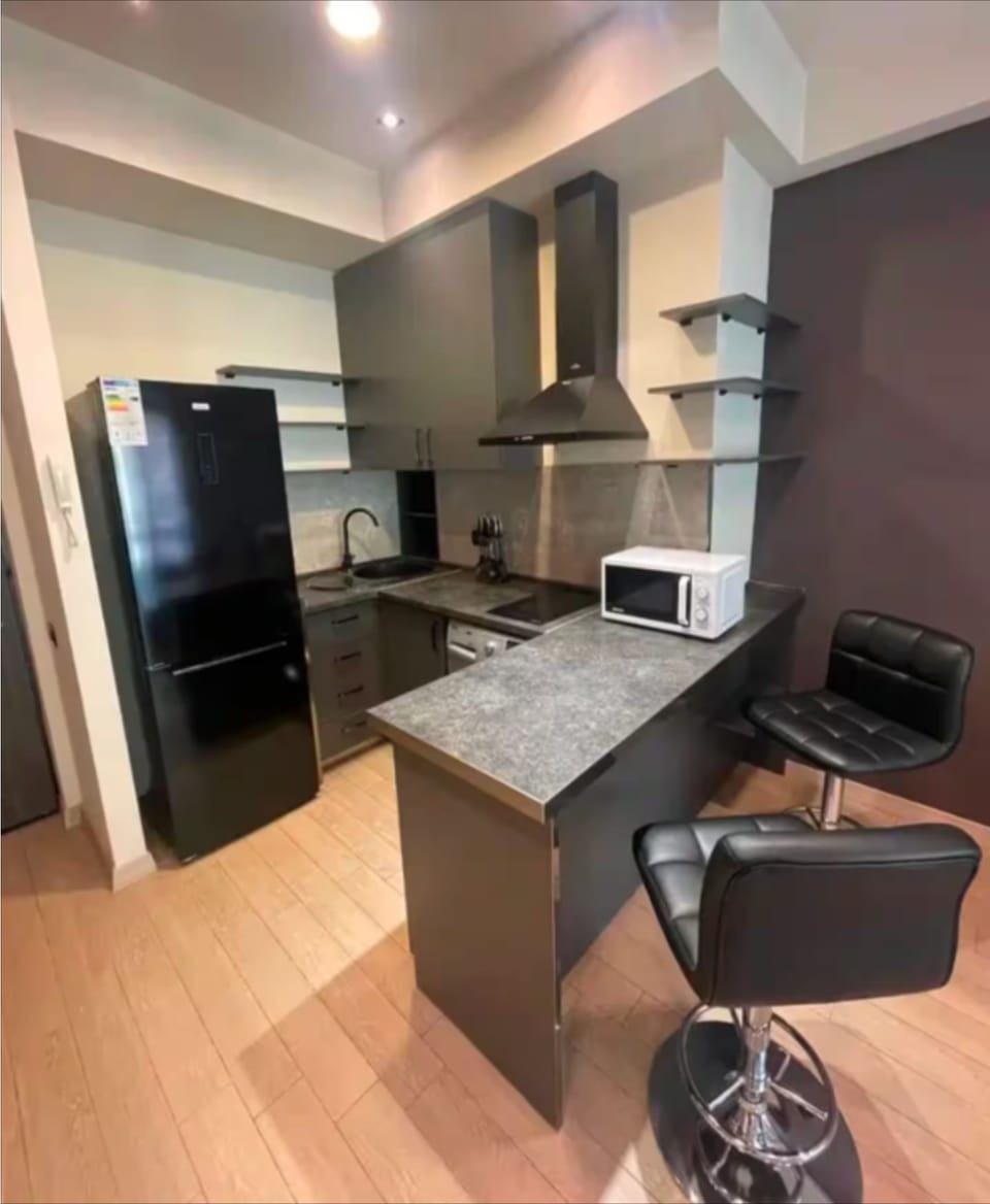 Signature Condo, Non Smoking, Balcony | Private kitchen | Fridge, cookware/dishes/utensils