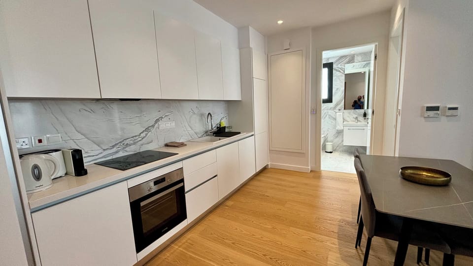 Deluxe Apartment, City View | Private kitchen | Microwave, oven, stovetop, highchair
