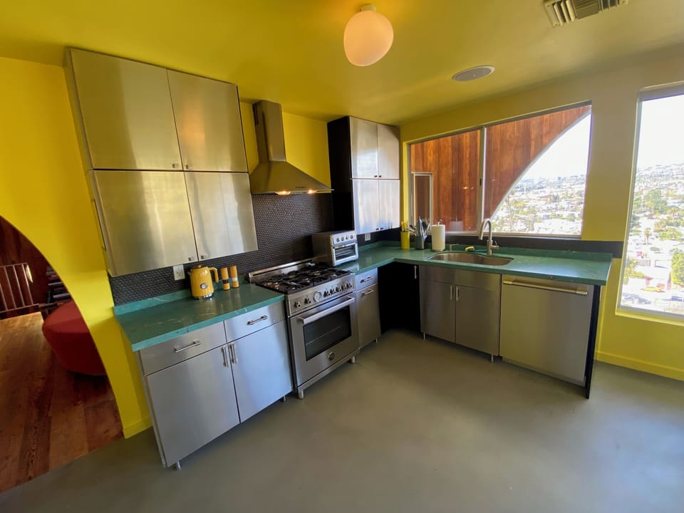 ...turquoise quartz countertops, Thermador dishwasher...