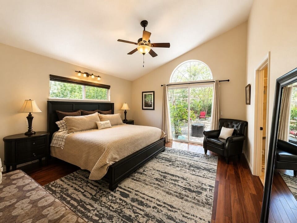 Master bedroom with king bed and sliding doors to backyard haven