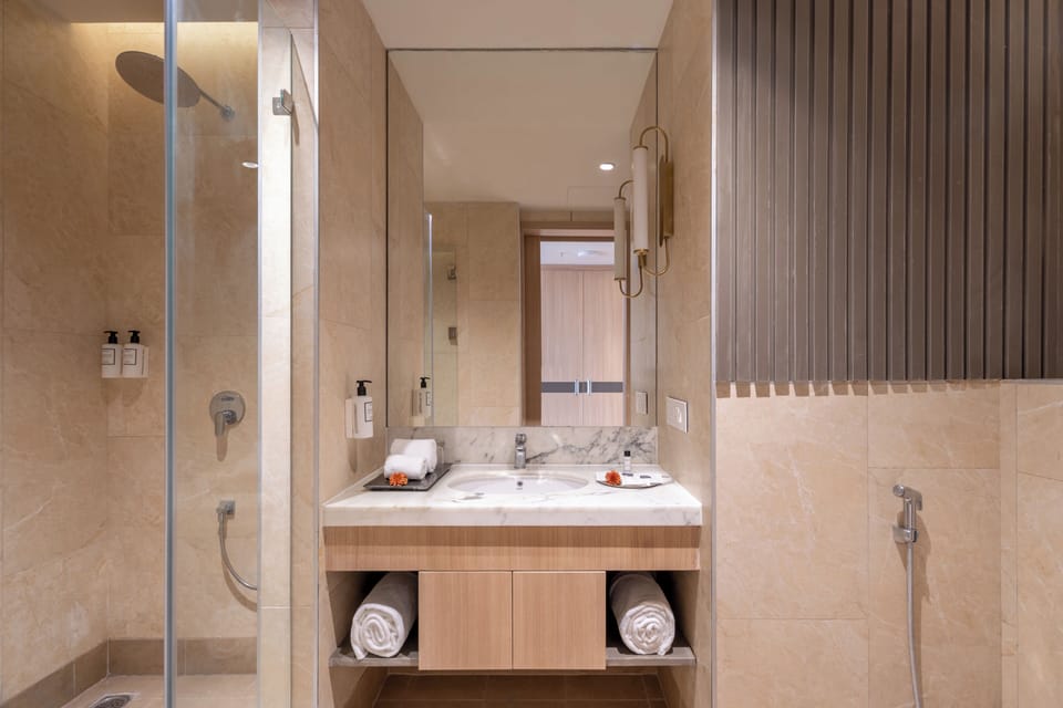 Signature | Bathroom | Shower, slippers, towels, soap
