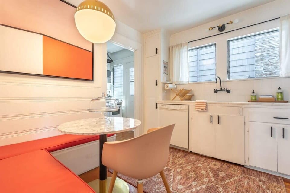 Prepare your favorite meals effortlessly in our sleek, fully equipped kitchen designed for comfort and convenience.