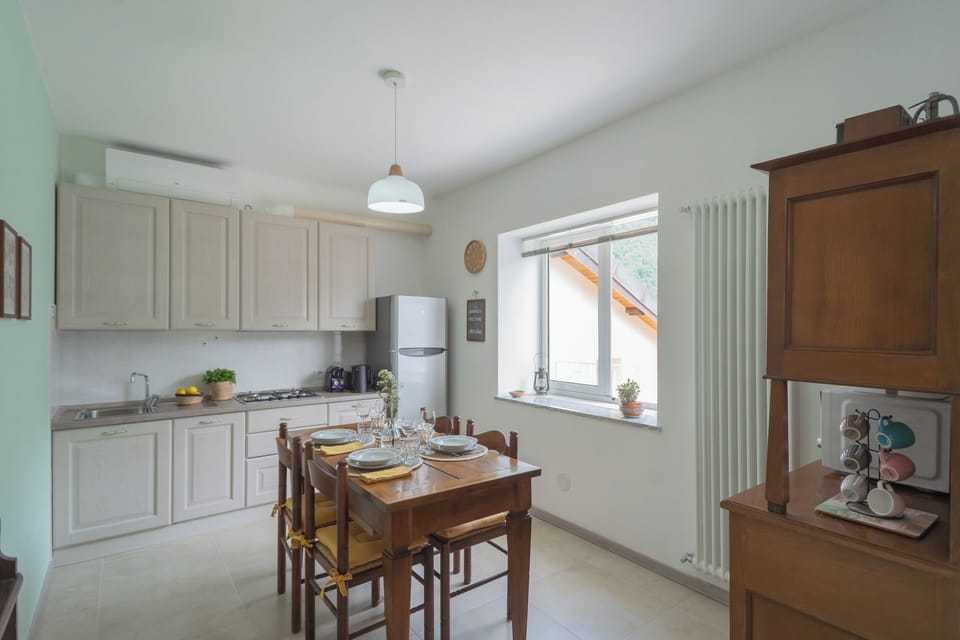 Apartment (2 Bedrooms) | Private kitchen | Microwave, espresso maker, electric kettle, highchair
