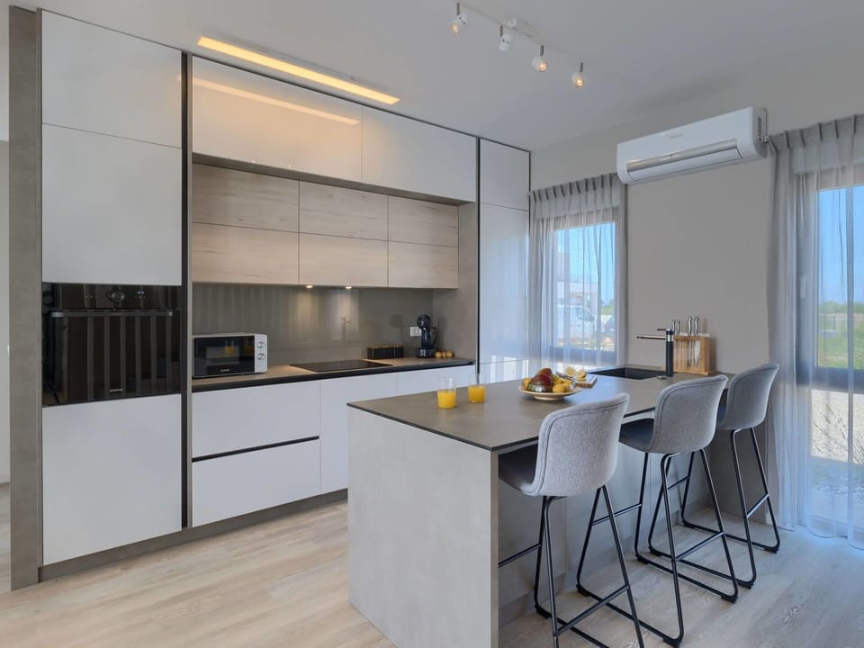 Furniture, Kitchen, Interior Design, Flooring, Countertop, Cabinetry, Wood, Floor, Kitchen Appliance, Kitchen & Dining Room Table