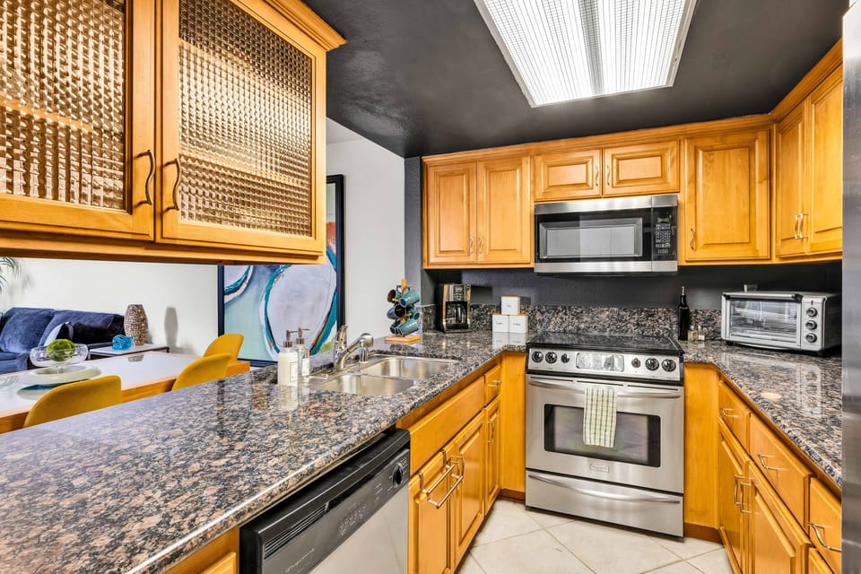 Bright kitchen with pass-through bar and ample prep space