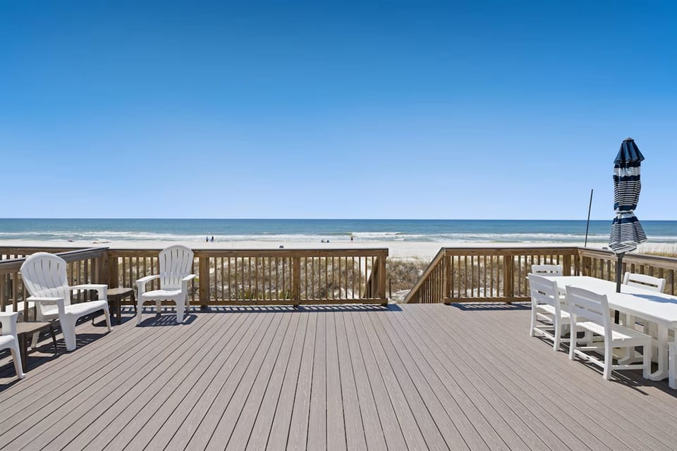 Relax in your private beachfront paradise where morning coffee meets ocean breeze on this expansive deck.
