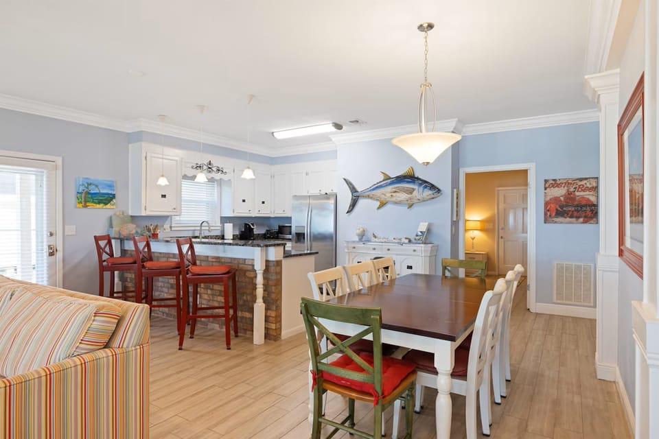 Gather around your spacious dining table for memorable meals, with a fully equipped kitchen ready for your culinary adventures.