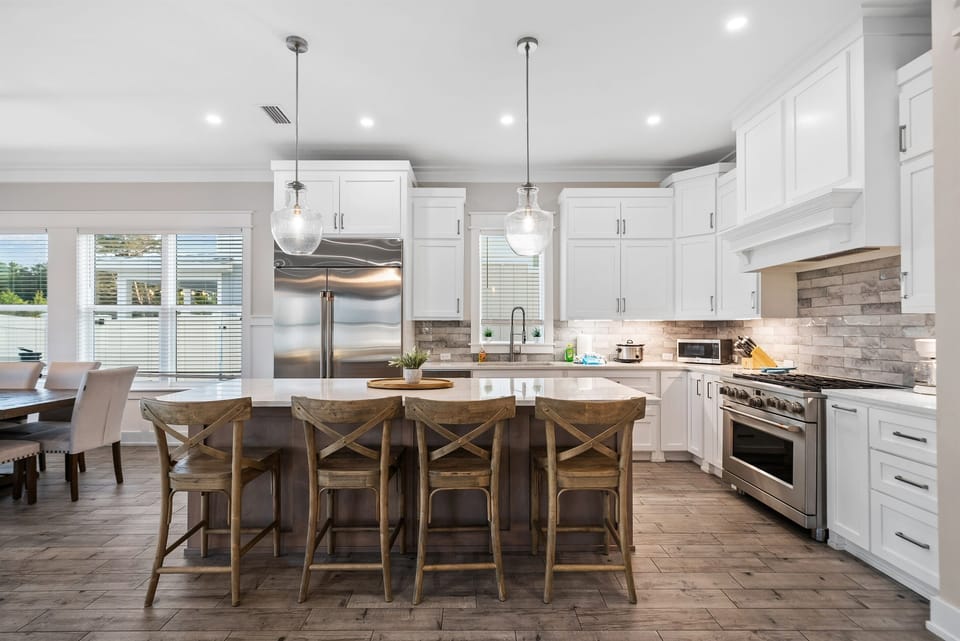 Your gourmet kitchen awaits with gleaming countertops, professional appliances, and a spacious island perfect for cooking memorable meals together.