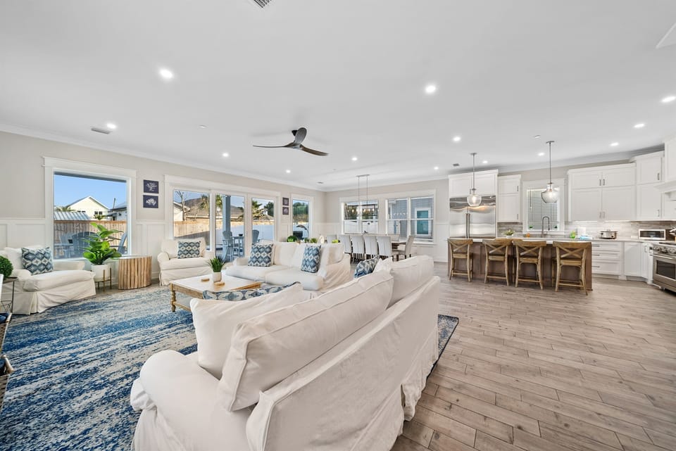 Sink into plush seating in this bright open-concept space where your kitchen flows seamlessly into the living area for effortless entertaining.