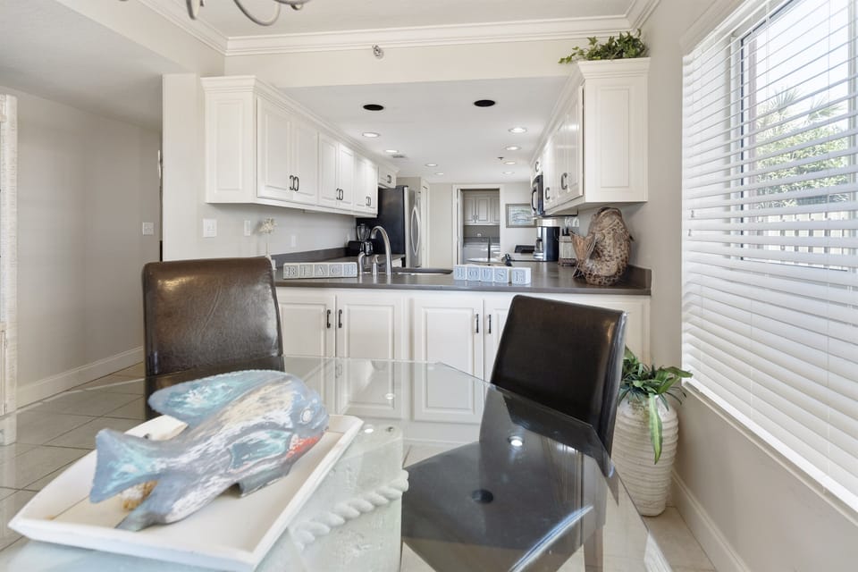 Your bright, fully-equipped kitchen invites culinary adventures with modern appliances and gleaming countertops where memories are made.